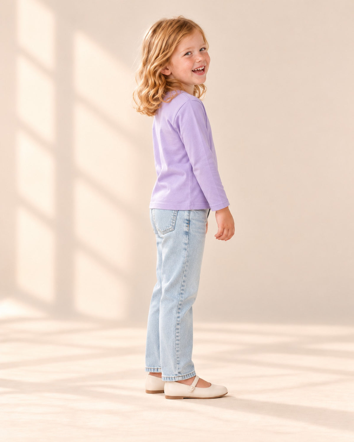 Side view of the lilac tee with the light wash jeans – Lilac