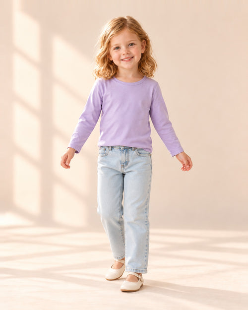 Girl in the lilac long-sleeve tee and straight jeans, standing relaxed – Lilac