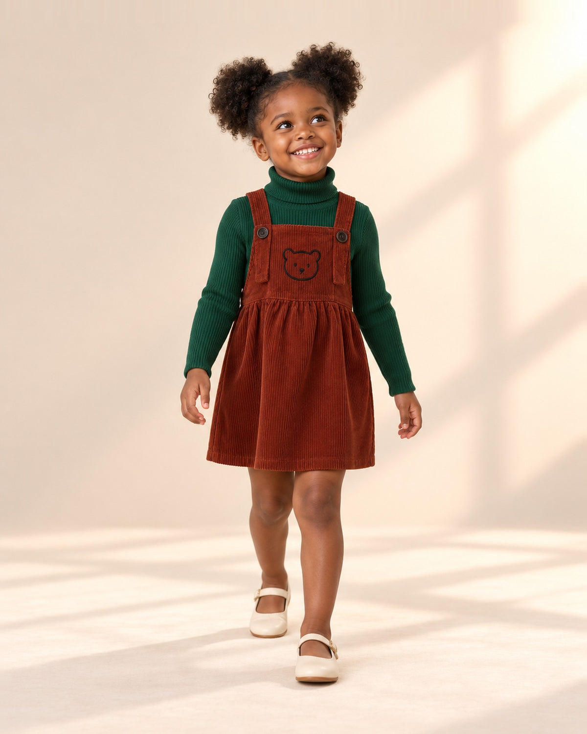 Girl in the forest green turtleneck and rust corduroy pinafore, standing at ease – Forest Green