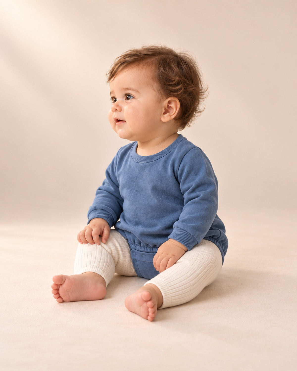 Side view of the cream ribbed leggings under the blue romper – Cream