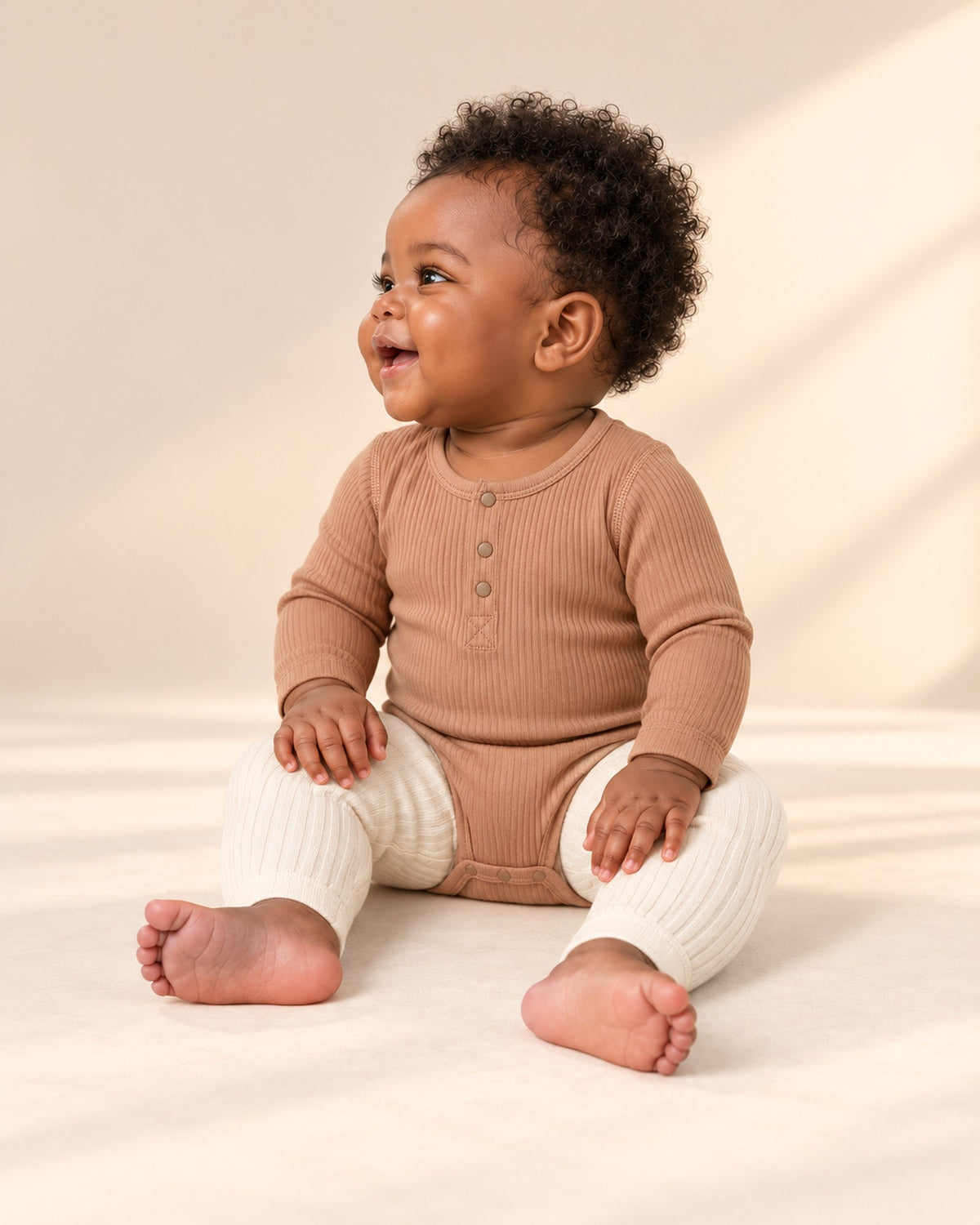 Side view of the caramel ribbed bodysuit with the cream leggings – Caramel