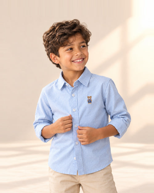 Close-up of the light blue oxford shirt with a small embroidered bear – Light Blue