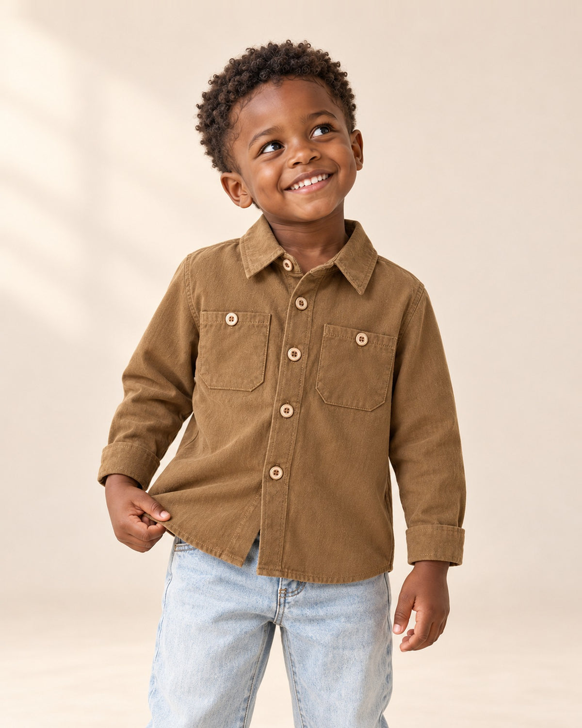 Boy in the Silas camel cotton pocket shirt, shown from head to hem – Camel