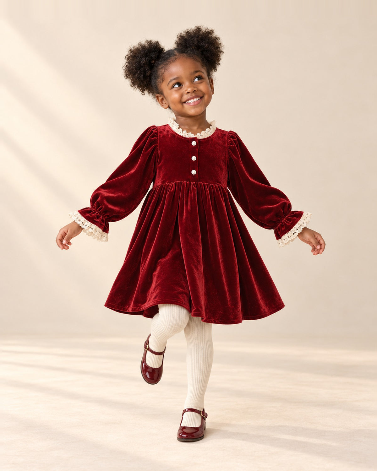 Girl in a relaxed pose wearing the deep red velvet dress and cream ribbed tights – Red