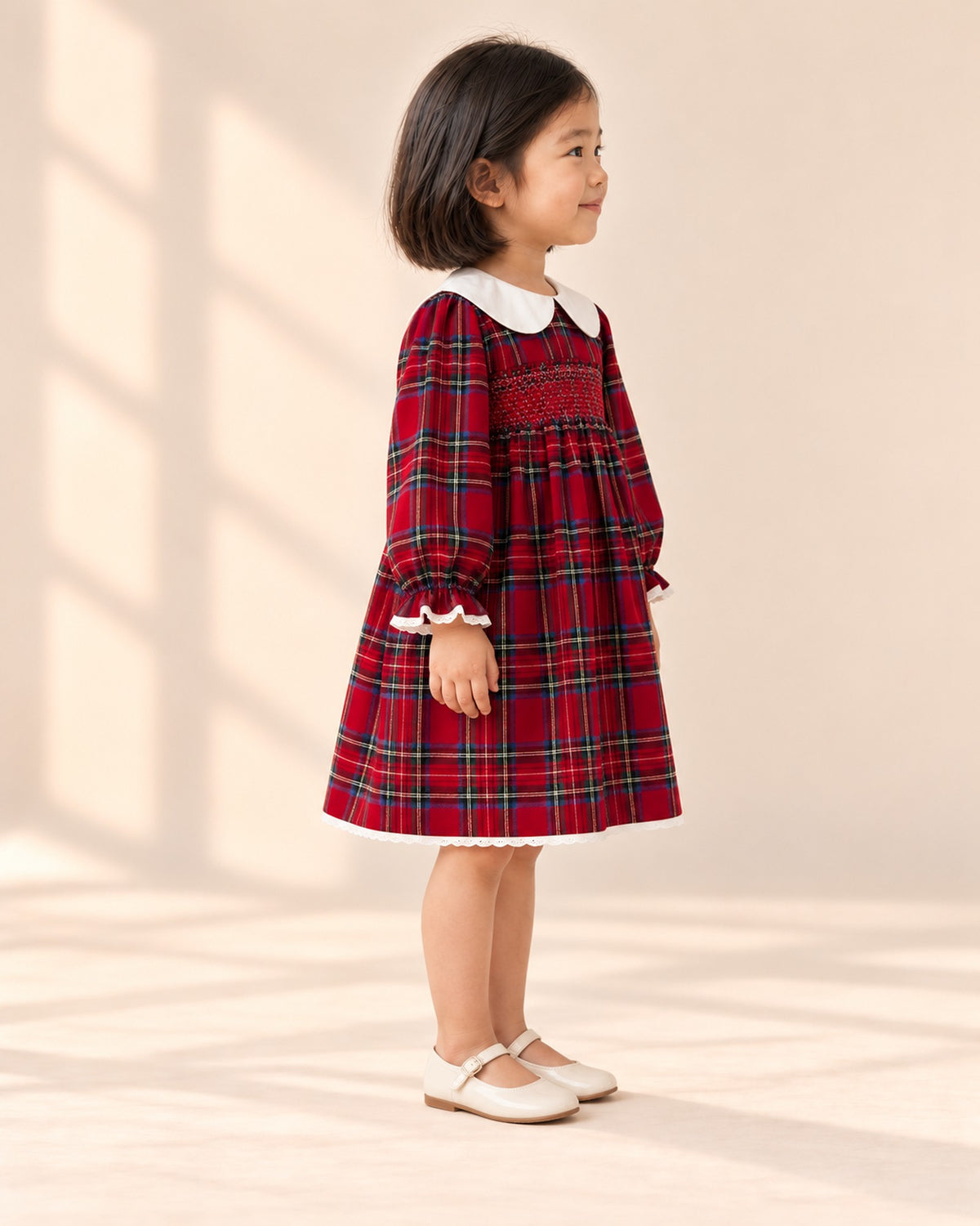 Side view of the tartan dress showing the long sleeves and A-line skirt – Red Tartan