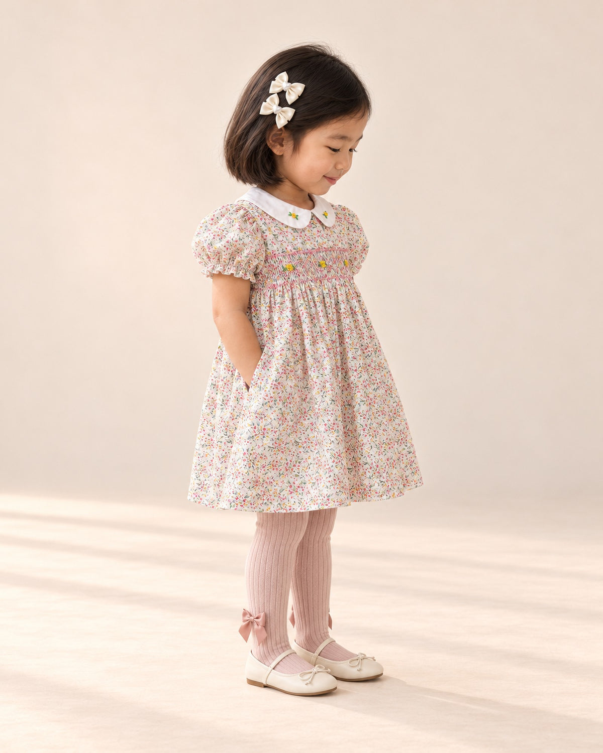 Side view of the cream flats showing the thin elastic strap and soft sole – Cream