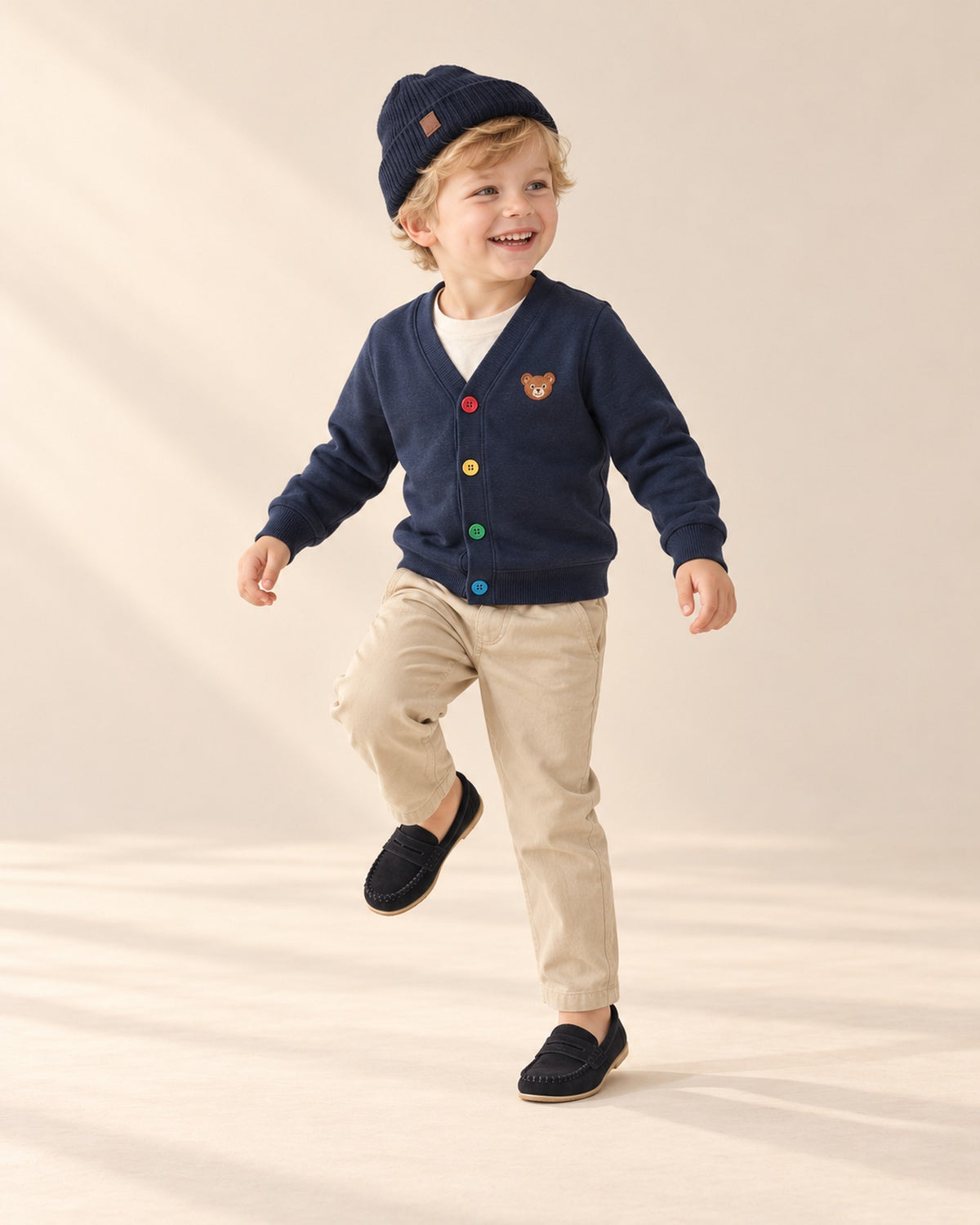 Boy walking in his navy cardigan outfit and black slip-on loafers – Black