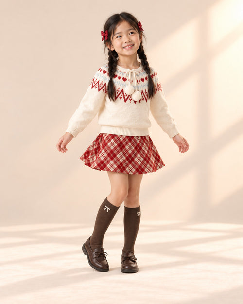 Girl in her Fair Isle Christmas outfit and brown loafers, sitting by a window – Brown