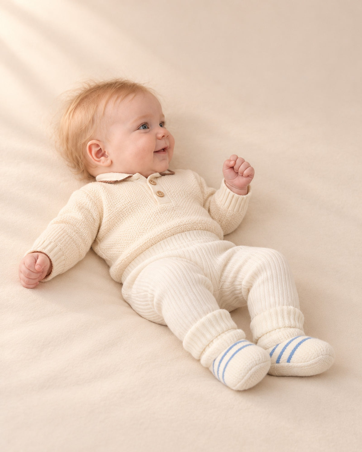 Side view of the cream booties showing the high ribbed cuff – Blue Stripe