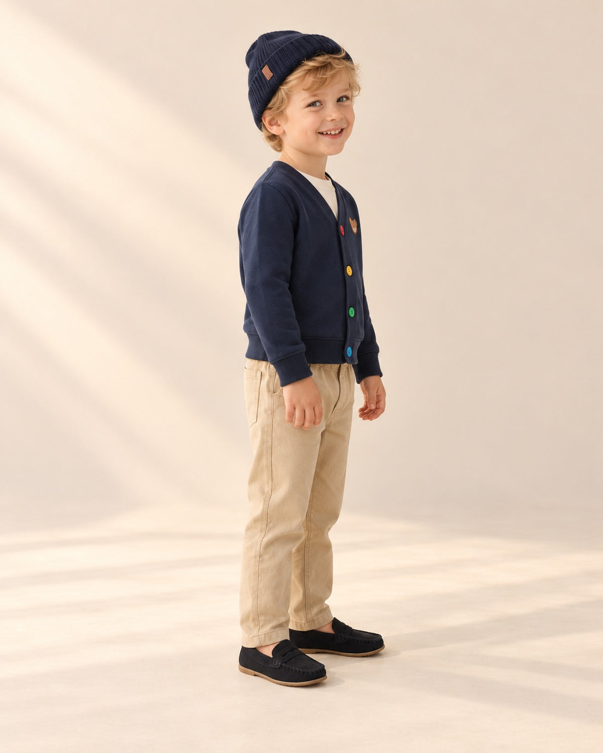 Side view of the navy beanie showing the fold-over cuff and rib knit – Navy