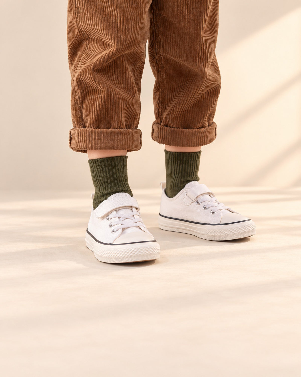 Close-up of a boy's legs from knee to floor in ribbed crew socks and white canvas sneakers – Dark Mix