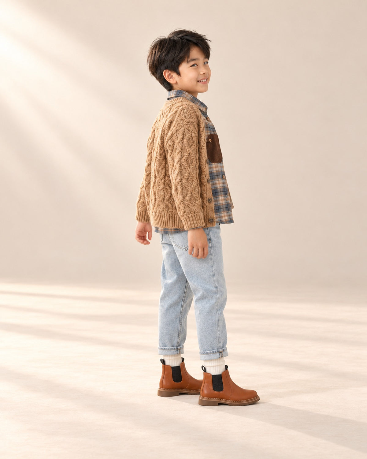 Side view showing the cream crew socks above the Chelsea boots – Cream