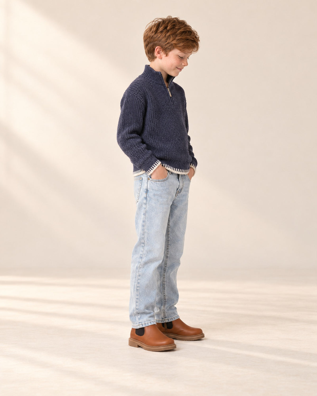 Side view of the navy half-zip sweater with straight jeans and Chelsea boots – Navy
