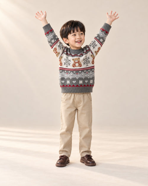 Boy in the grey Albert bear sweater and chinos, playful holiday pose in the studio, head to toe – Grey
